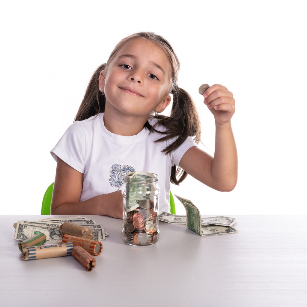 Girl Counting Piggy Bank Savings