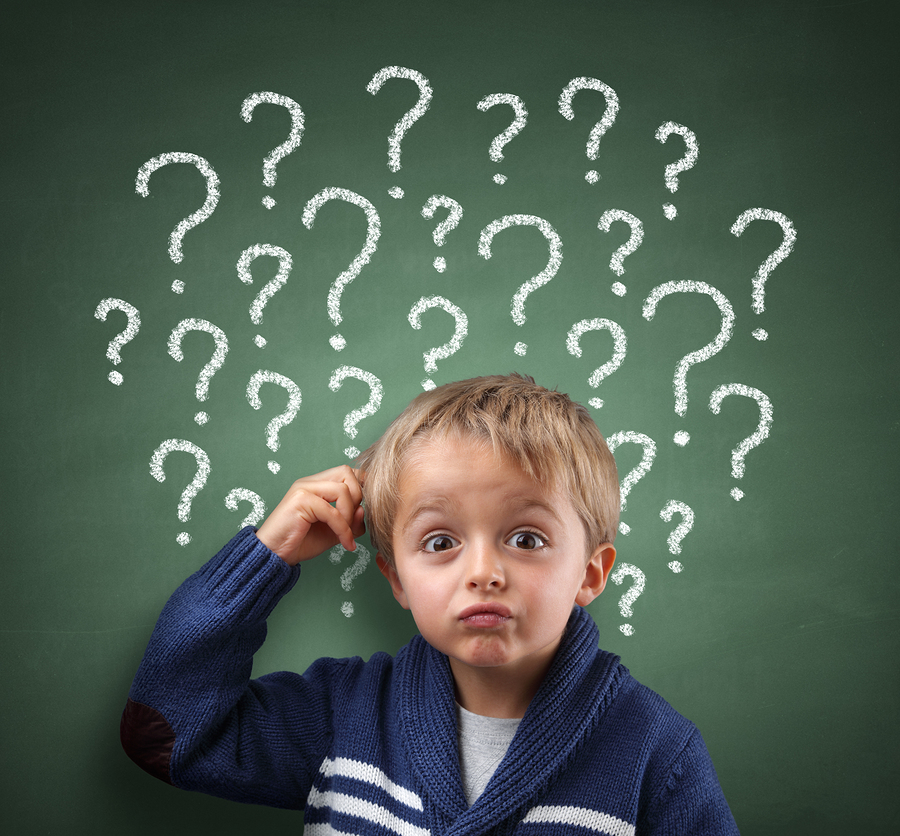 child scratching head with question mark on blackboard concept f